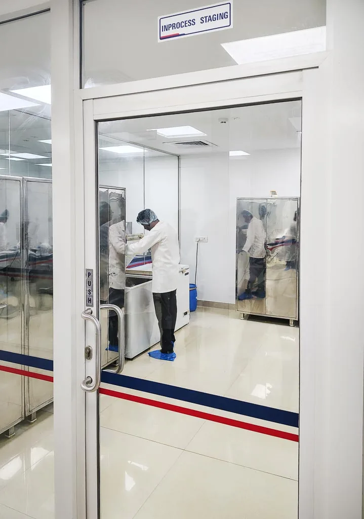 Operator working in the Stabicon in-process staging cleanroom viewed through the entry door